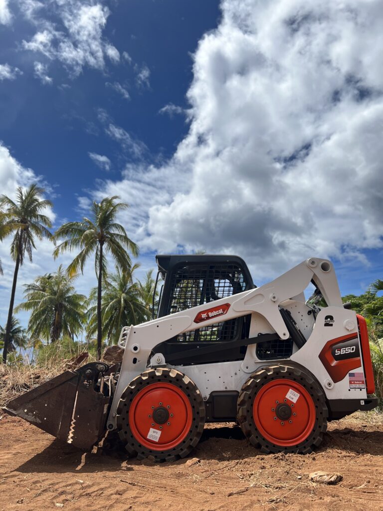 S650 Skid Steer with bucket. This four-in-one attachment can be used as a bucket for loading, carrying and dumping; as a grapple for handling odd-shaped objects; or for dozing, leveling and spreading material with the clamshell open.